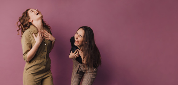 Portrait of two young happy friends, studio shoot,