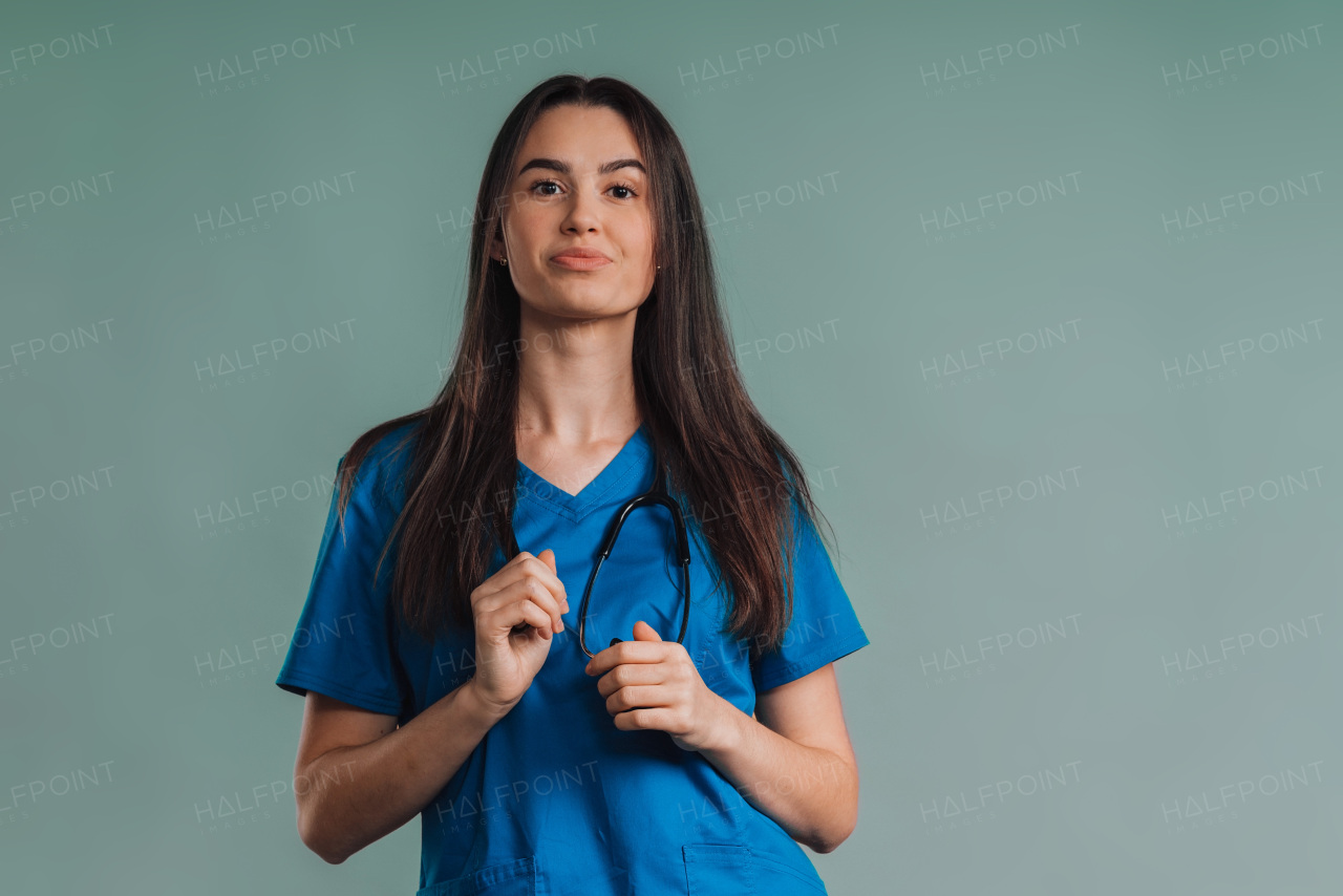 Portrait of young nurse with a stethoscope, studio shoot.