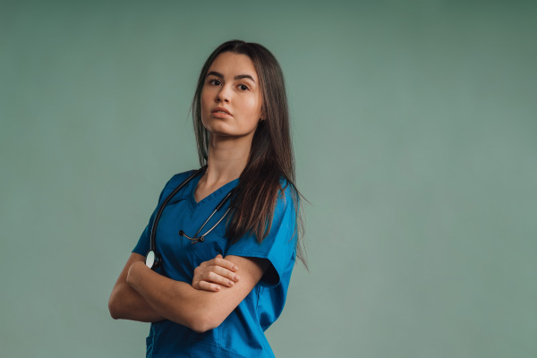 Portrait of young nurse with a stethoscope, studio shoot.