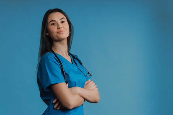 Portrait of young nurse with a stethoscope, studio shoot.