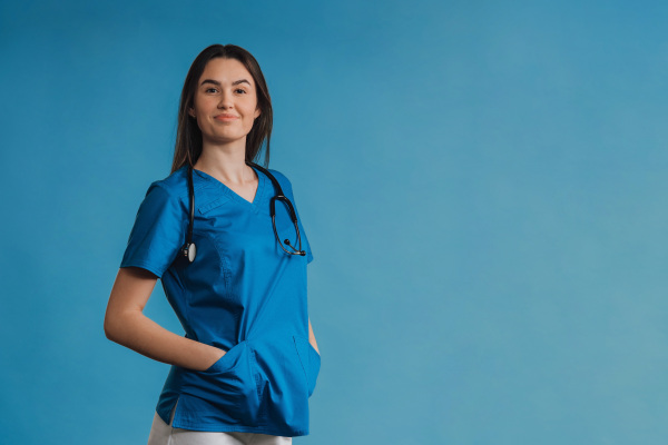 Portrait of young nurse with a stethoscope, studio shoot.