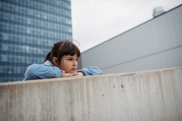 Sad girl alone in the city. Young girl spending free time alone in the city, no friends, no activity. Mental health problems.