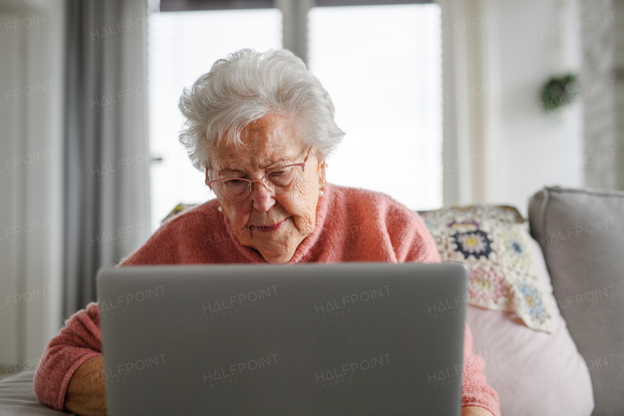 Senior woman learning to work with tablet, technology and internet, maintaining digital skills. Importance of digital literacy for elderly people.