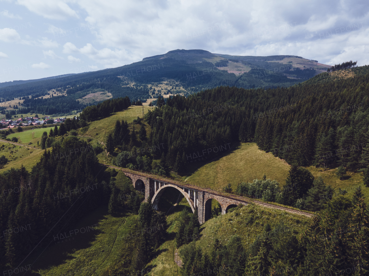 Aerial view of the historical stone railway bridge in Slovakia. High, fully preserved stone arch railway bridge.