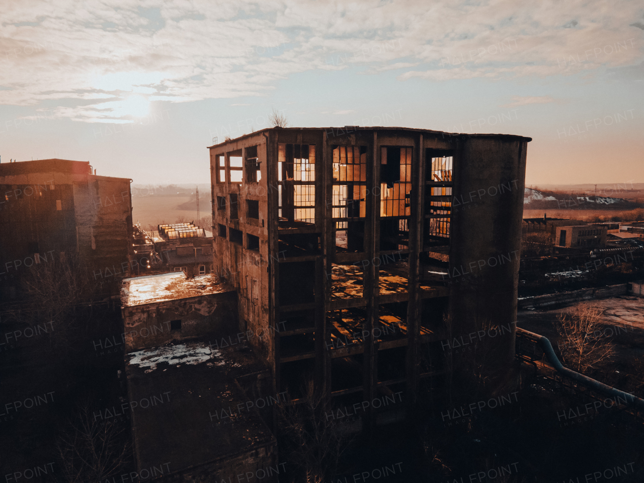 Aerial view of an old abandoned building, skyscraper in the city. Old derelict building in a bad state.