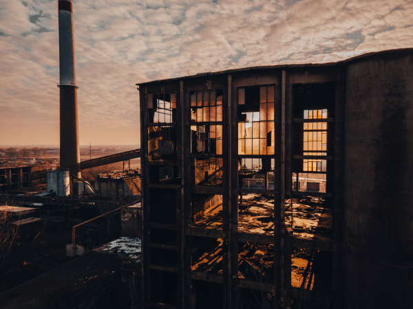 Aerial view of an old abandoned building, skyscraper in the city. Old derelict building in a bad state.