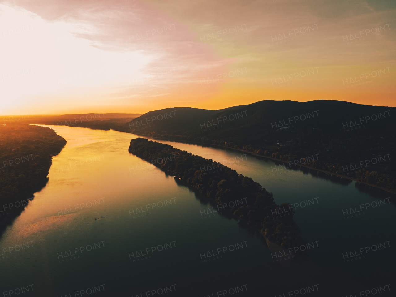 Top view of river shore, surrounded by forest with sand beach, coastline. River, riverine island.