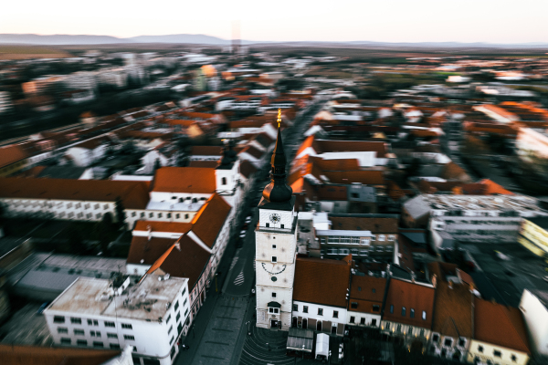 Aerial view of the city center, church, its church tower with a blurred background.