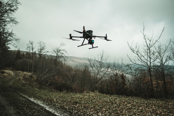 Aerial view of a drone moderning over forest, monitoring and analyzing in the forestry management. Dron mapping forest after natural disaster assessing damage.