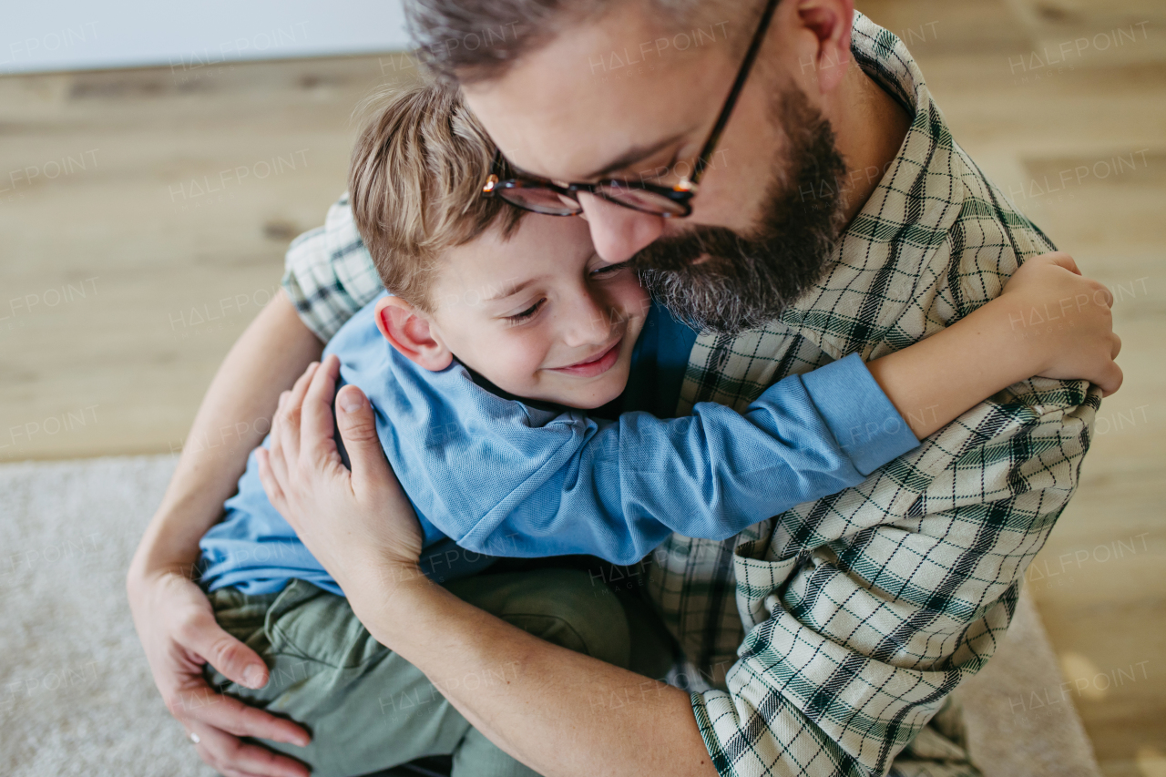 Dad hugging, embracing little son, true love. Happy Fathers day concept.