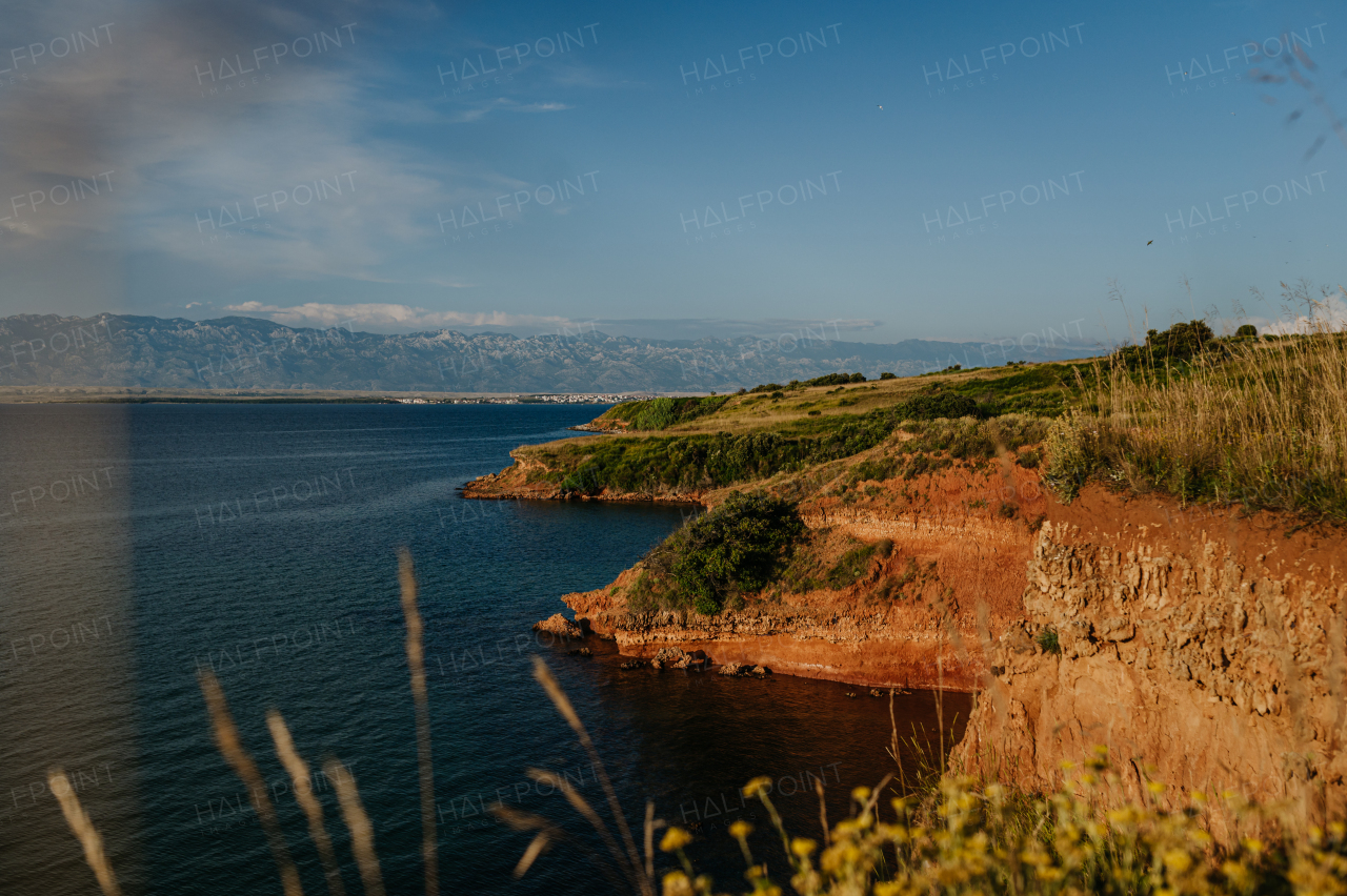 Beautiful landscape of Croatia, Croatia coast, blue water of adriatic sea with shoreline during sunset.