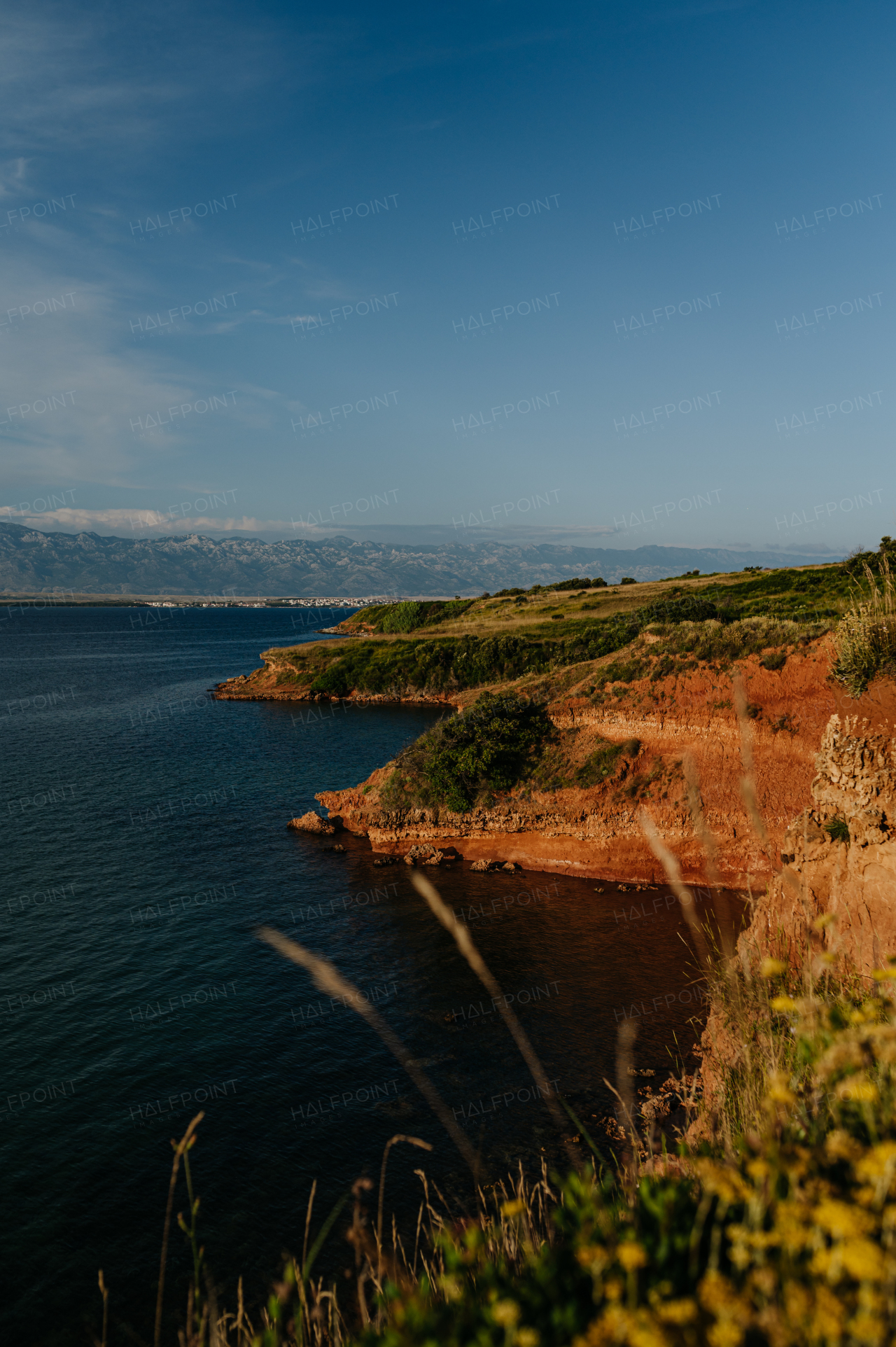 Beautiful landscape of Croatia, Croatia coast, blue water of adriatic sea with shoreline during sunset.