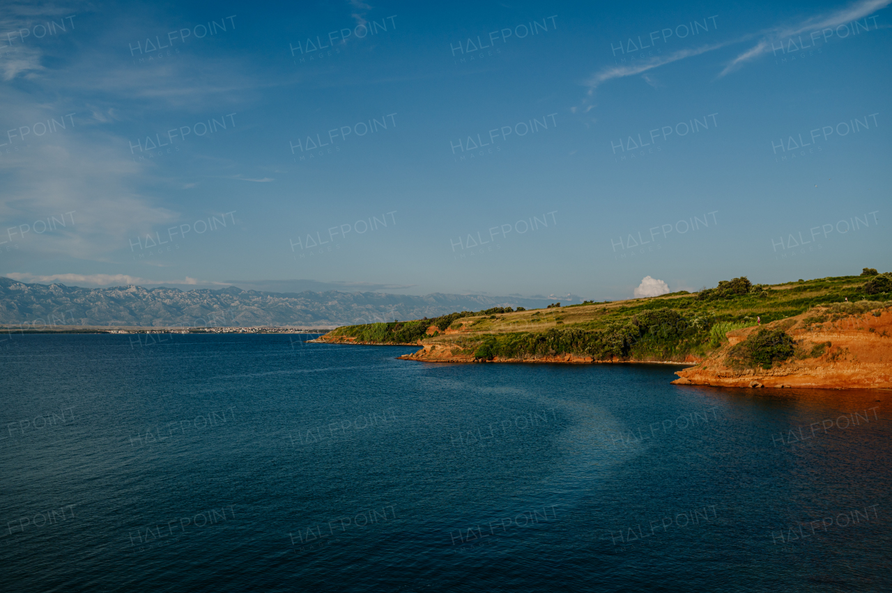 Beautiful landscape of Croatia, Croatia coast, blue water of adriatic sea with shoreline during sunset.