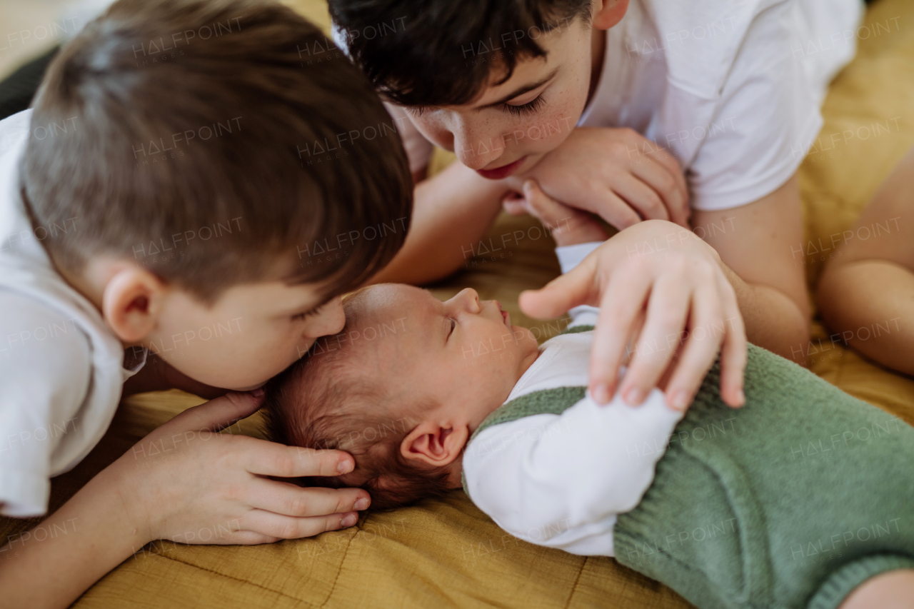 Big brothers with their newborn brother.