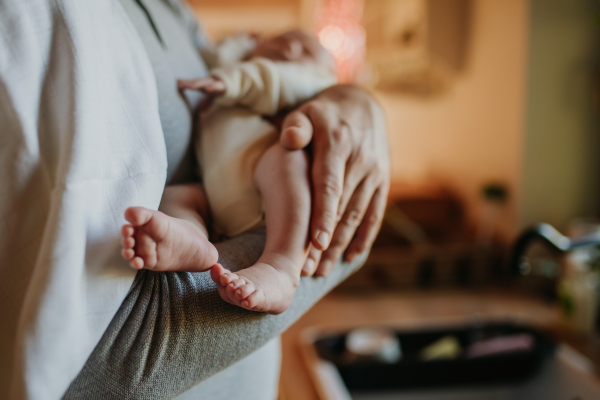 Close-up of father holding his little new born baby.