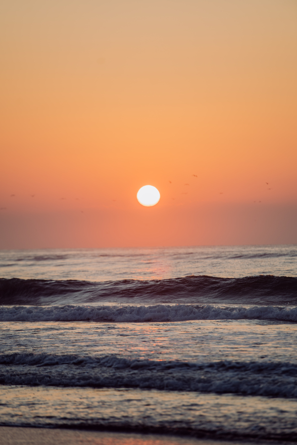 Landscape with sea sunset on a beach.