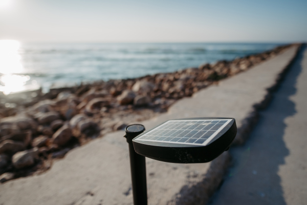 Close-up of street solar lighting near the beach.