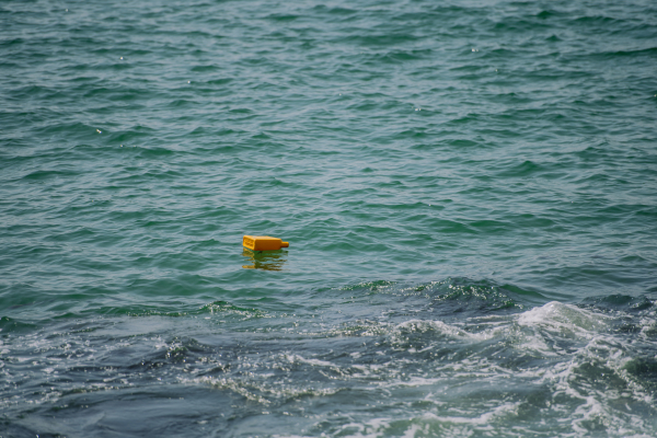 Close up of floating trash in ocean.