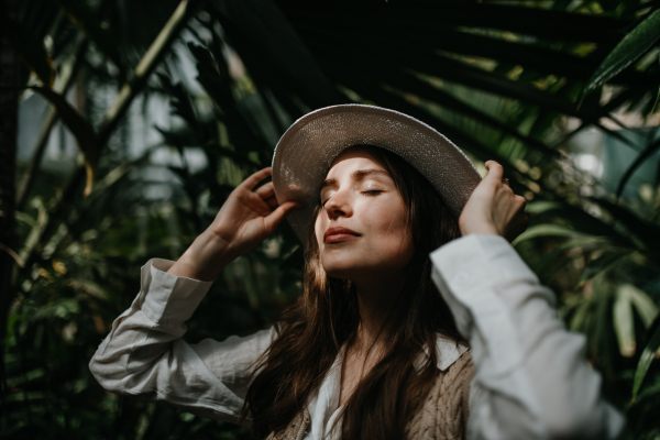 Portrait of a young woman in jungle.