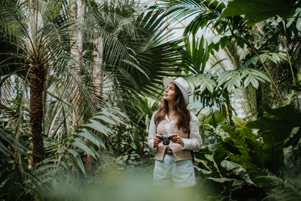 Portrait of a young woman in jungle.