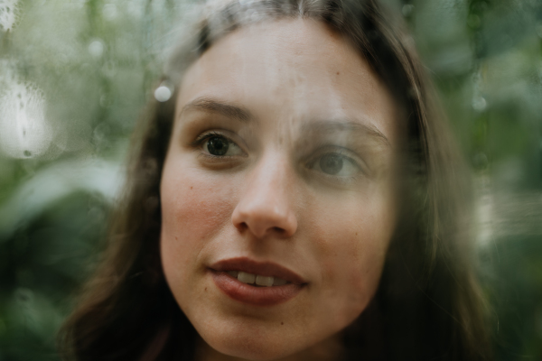 Portrait of a young woman in jungle.