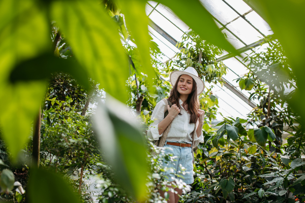 Portrait of a young woman in jungle.