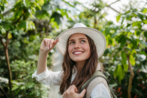 Portrait of a young woman in jungle.