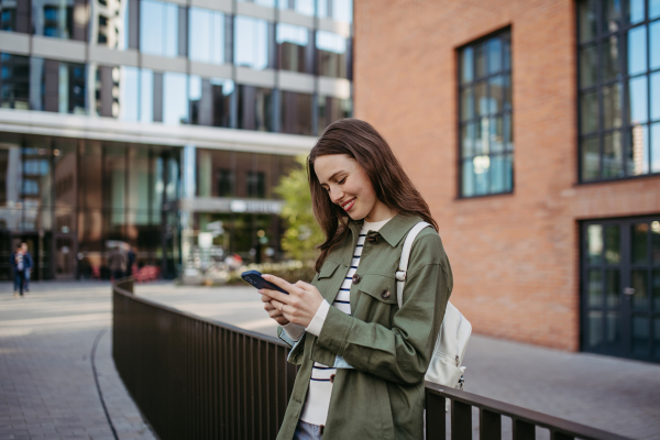 Portrait of a young woman in a city.