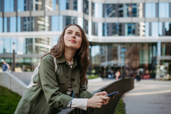 Portrait of a young woman in a city.