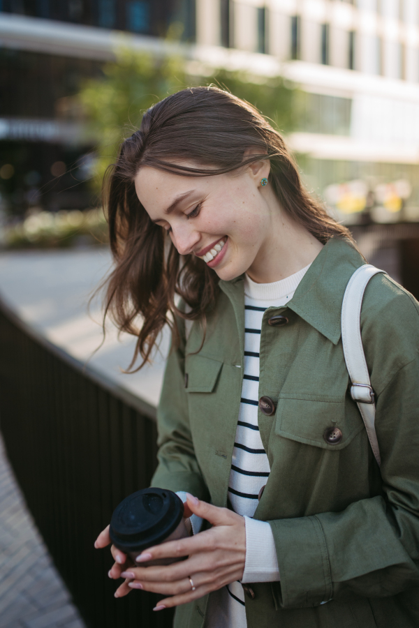 Portrait of a young woman in a city.