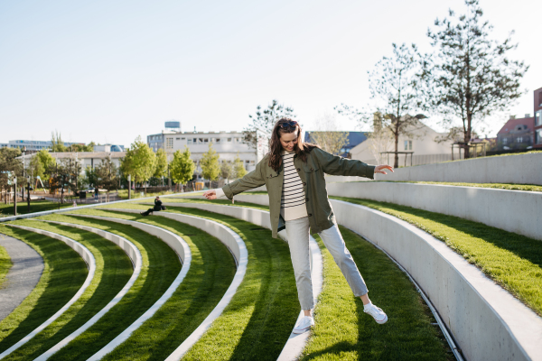 Young woman spending her free time in a city park.