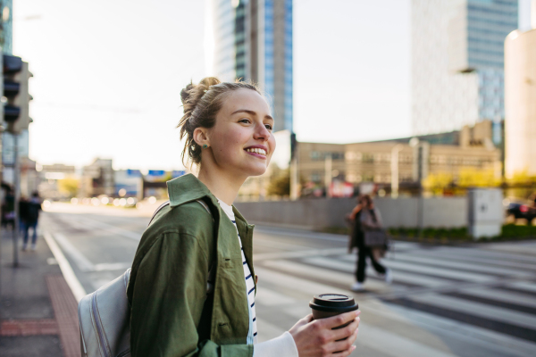 Portrait of a young woman in a city.