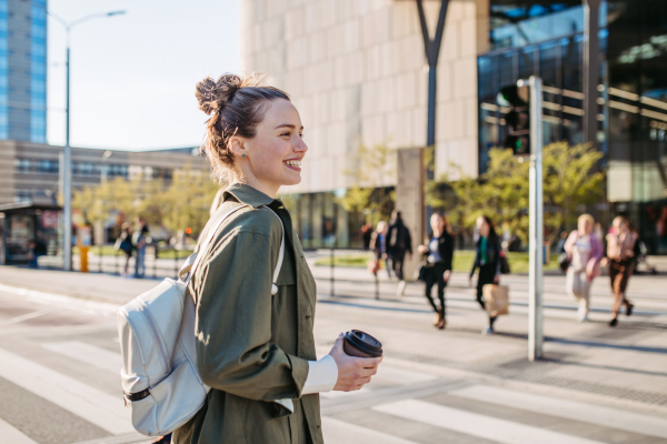 Portrait of a young woman in a city.