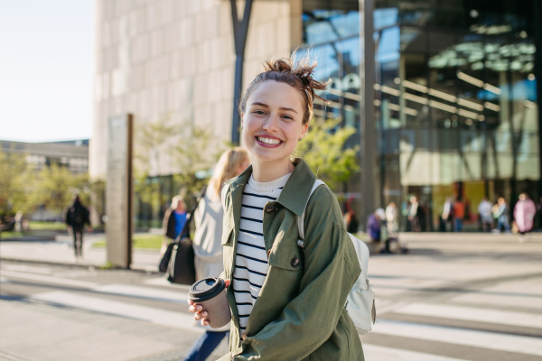 Portrait of a young woman in a city.