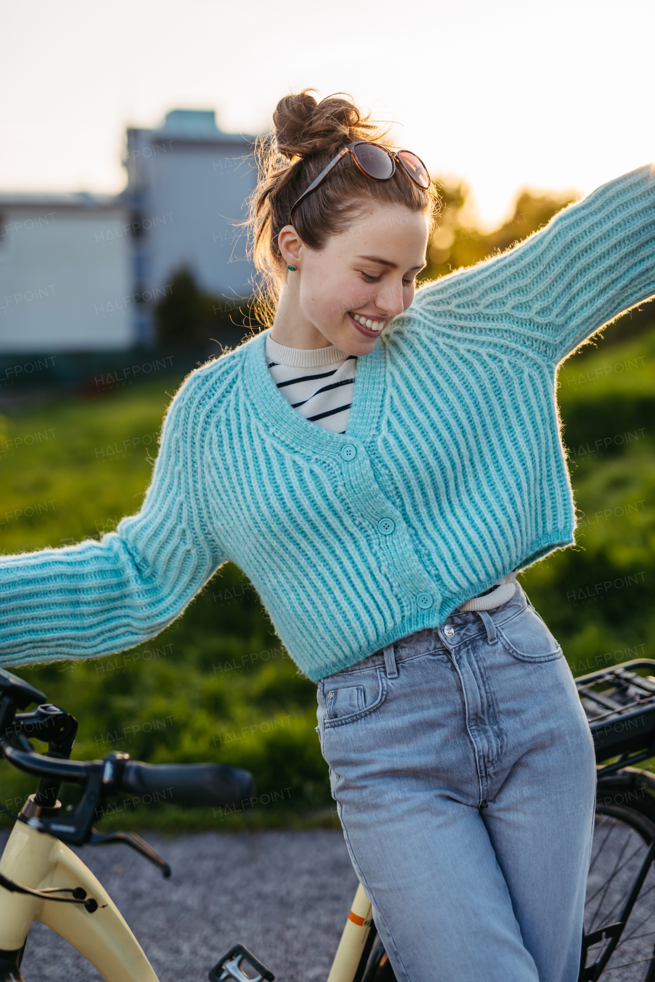 Young woman on an electro bicycle, concept of commuting and ecologic traveling.