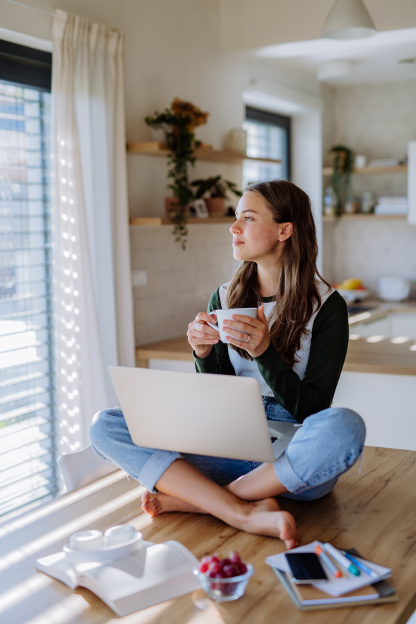 Young woman having homeoffice in an apartment.