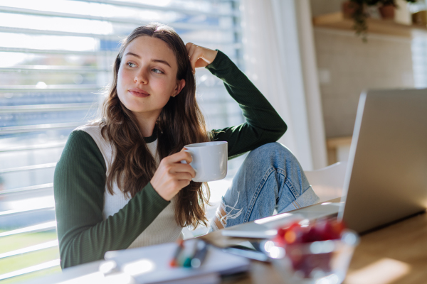 Young woman having homeoffice in an apartment.