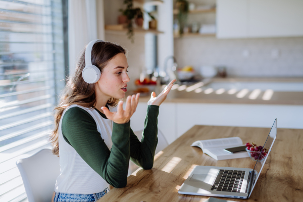 Young woman having hvideo call in an apartment.