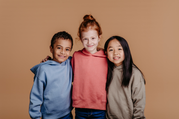 Portrait of three children, studio shoot. Concept of diversity in a friendship.