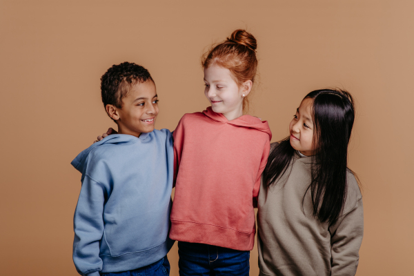 Portrait of three children, studio shoot. Concept of diversity in a friendship.