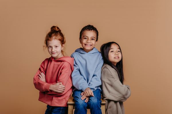 Portrait of three children, studio shoot. Concept of diversity in a friendship.