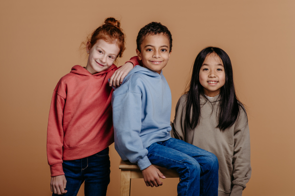 Portrait of three children, studio shoot. Concept of diversity in a friendship.