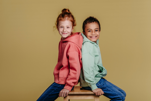 Boy with his friend posing during a studio shoot.