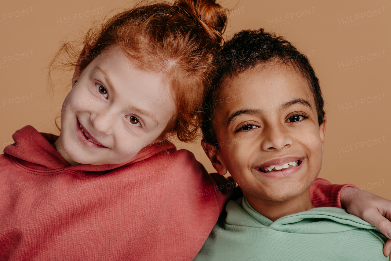 Boy with his friend posing during a studio shoot.