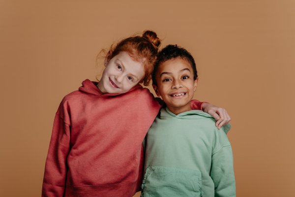 Boy with his friend posing during a studio shoot.