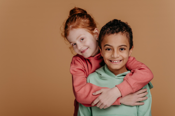 Boy with his friend posing during a studio shoot.