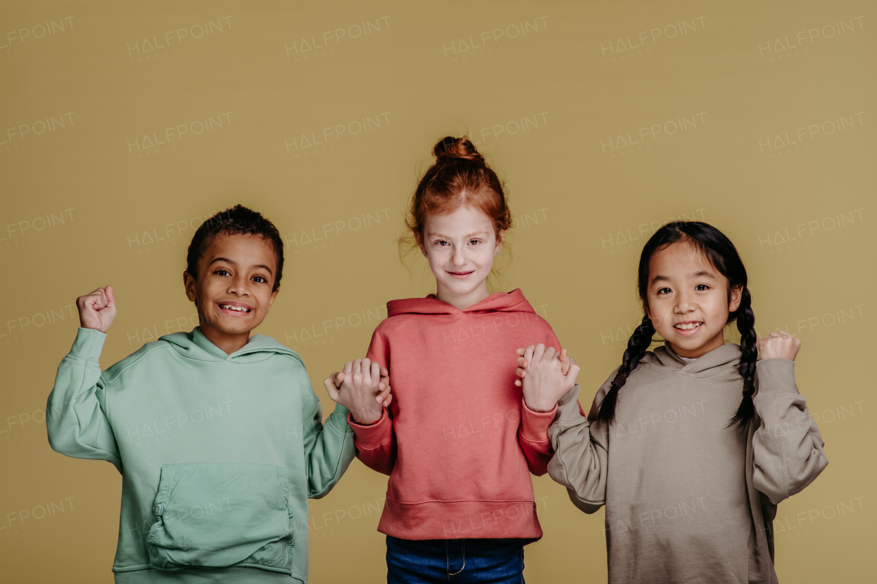 Portrait of three children, studio shoot. Concept of diversity in a friendship.