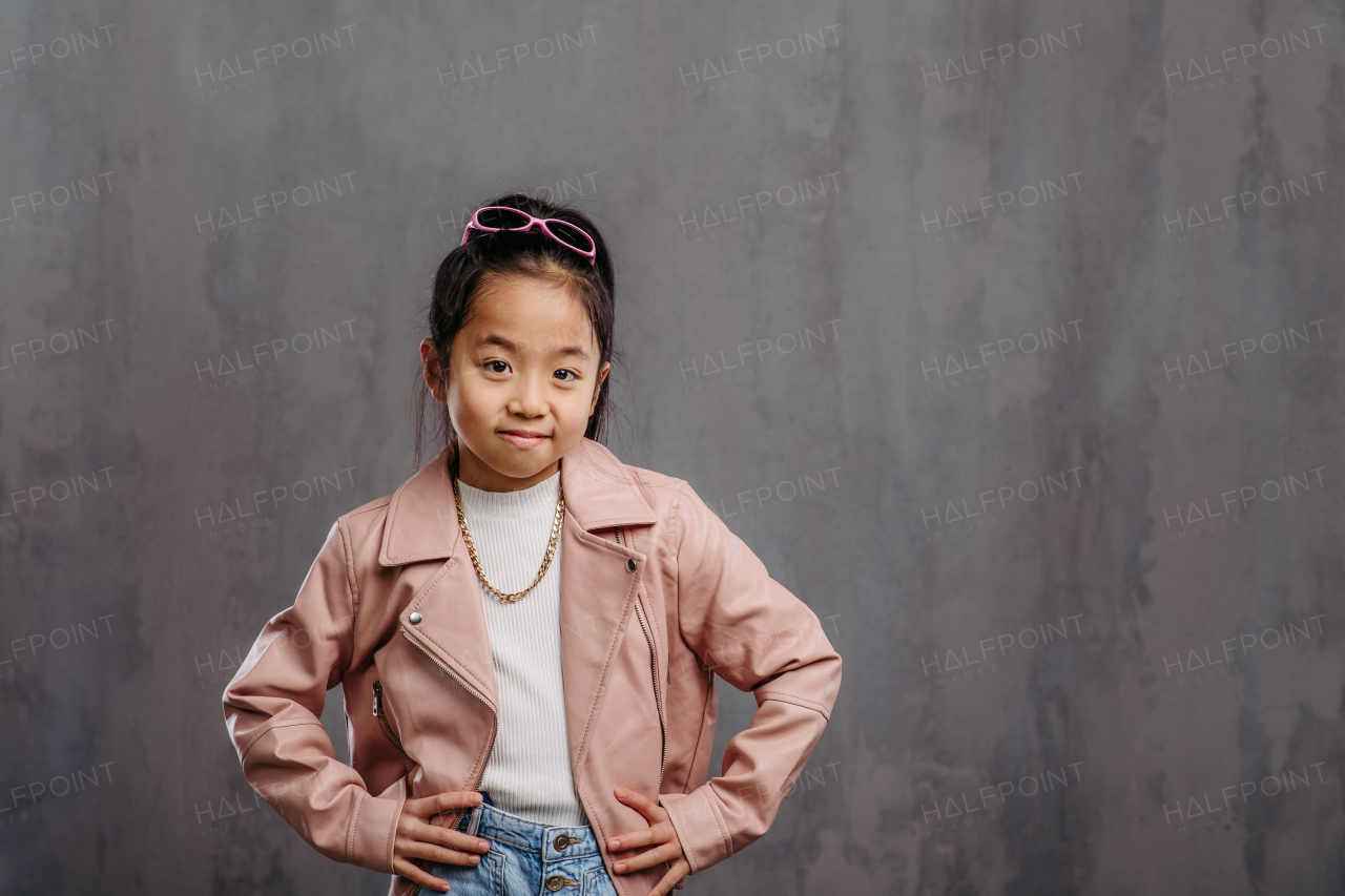 Portrait of little japanesse girl with a leather jacket.