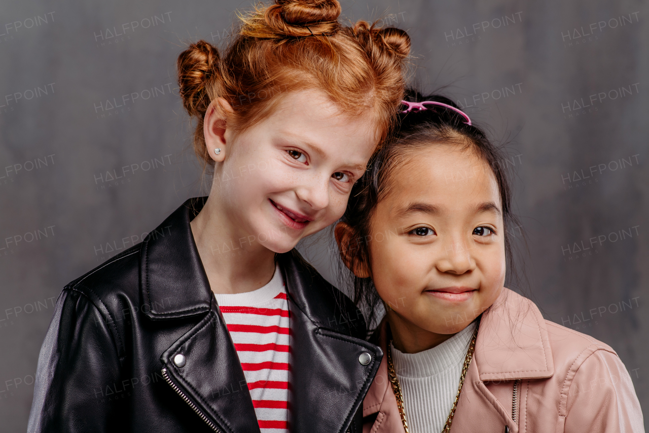 Portrait of two girls in a leather jacket.