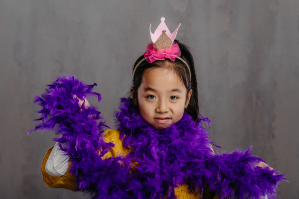 Portrait of little japanese girl in princess costume, studio shoot.